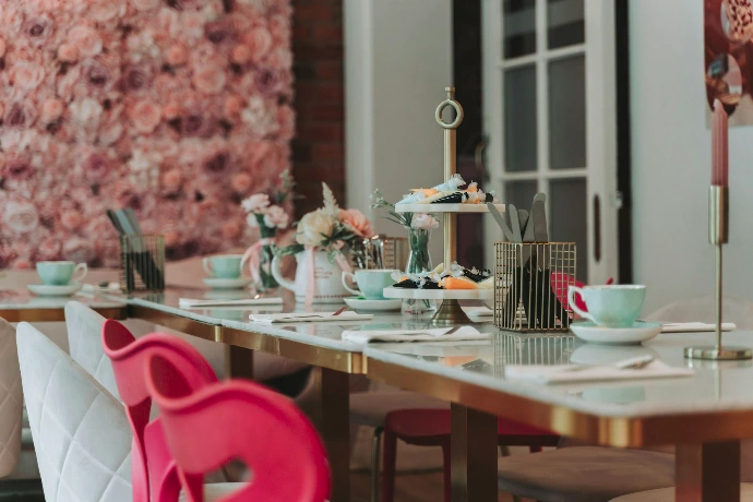a long table with plates and cups on it
